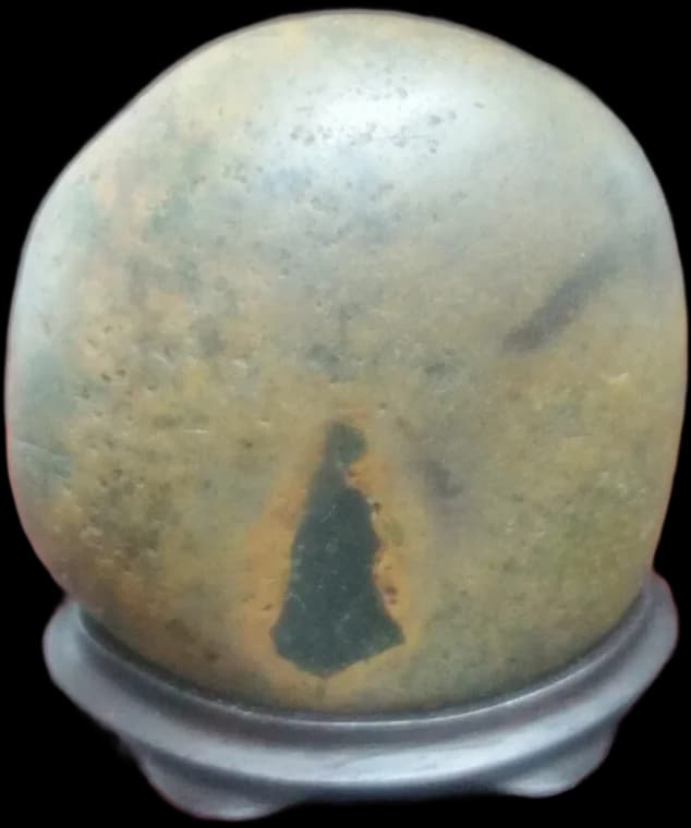 The One Who Waits — a viewing stone whose mineral vein reads as a standing figure